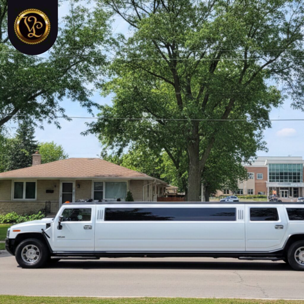 White stretch Hummer limousine parked on a suburban street with houses and trees in the background